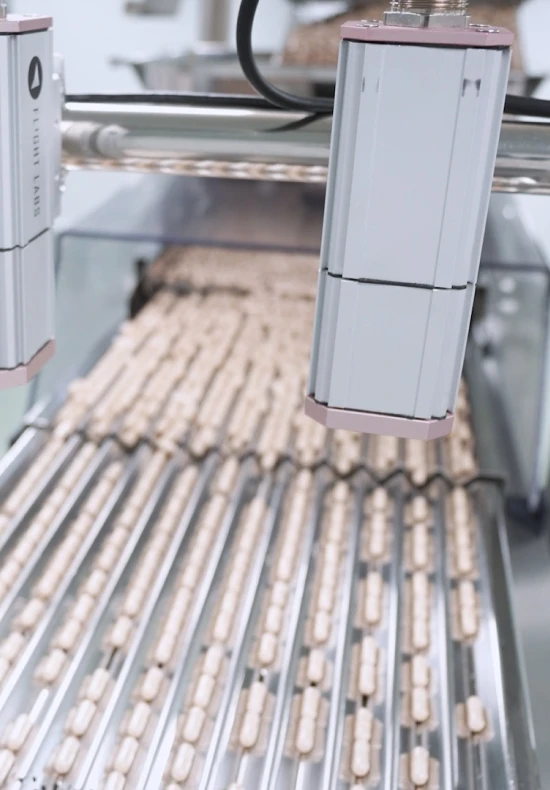 control calidad automatizado examinando capsulas